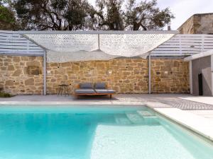 The swimming pool at or close to Villa Evrithea