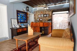 a living room with a table and a couch at Grand Erken Hotel in Antalya
