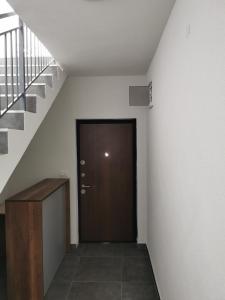 a hallway with a staircase and a door and a stair case at GOPO Guesthouse Elshani in Ohrid