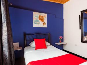 Postel nebo postele na pokoji v ubytování Hotel Casa Normandia