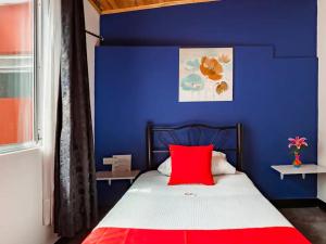 Postel nebo postele na pokoji v ubytování Hotel Casa Normandia