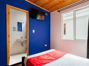 Postel nebo postele na pokoji v ubytování Hotel Casa Normandia