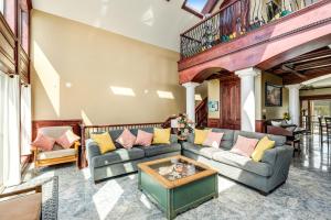 a living room with a couch and a table at Oceanfront Seascape in Rockaway Beach