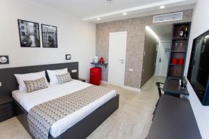 Postel nebo postele na pokoji v ubytování Batumi Premiums Apartments Betta + 17 fotografií