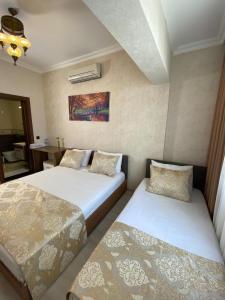 Postel nebo postele na pokoji v ubytování Boutique Sultan Hotel