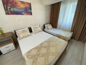 Postel nebo postele na pokoji v ubytování Boutique Sultan Hotel