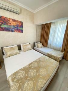Postel nebo postele na pokoji v ubytování Boutique Sultan Hotel