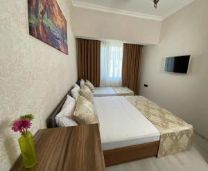 Postel nebo postele na pokoji v ubytování Boutique Sultan Hotel
