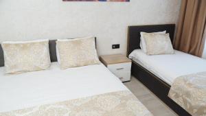 Postel nebo postele na pokoji v ubytování Boutique Sultan Hotel