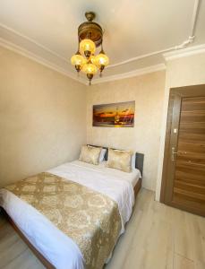 Postel nebo postele na pokoji v ubytování Boutique Sultan Hotel
