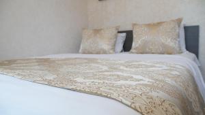 Postel nebo postele na pokoji v ubytování Boutique Sultan Hotel