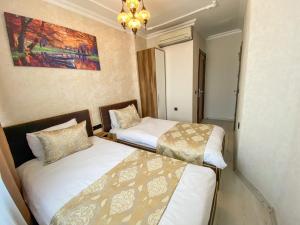 Postel nebo postele na pokoji v ubytování Boutique Sultan Hotel