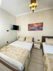 Postel nebo postele na pokoji v ubytování Boutique Sultan Hotel + 37 fotografií