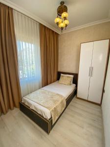 Postel nebo postele na pokoji v ubytování Boutique Sultan Hotel