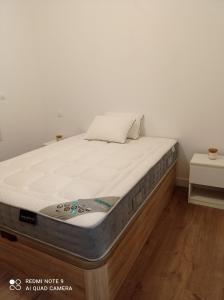 a mattress sitting on top of a bed in a room at AppartHôtel in Poitiers