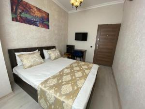 Postel nebo postele na pokoji v ubytování Boutique Sultan Hotel