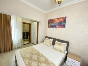 Postel nebo postele na pokoji v ubytování Boutique Sultan Hotel