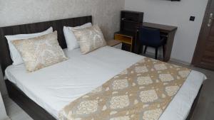 Postel nebo postele na pokoji v ubytování Boutique Sultan Hotel