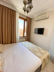 Postel nebo postele na pokoji v ubytování Boutique Sultan Hotel