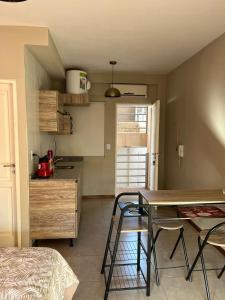 a kitchen with a table and chairs in a room at Alto del Bono in San Juan +17 photos