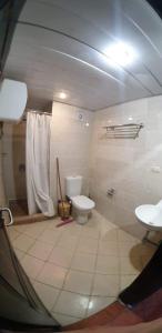 a bathroom with a toilet and a sink at شاليه فندقي ببورتو مارينا in El Alamein