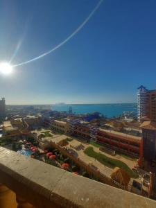 a view of a city with buildings and the ocean at شاليه فندقي ببورتو مارينا in El Alamein