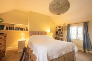 a bedroom with a white bed and a window at Mulsford B&B in Malpas