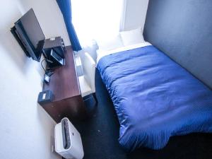 Postel nebo postele na pokoji v ubytování HOTEL LiVEMAX Tokyo Shiomi Ekimae