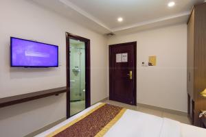 TV a/nebo společenská místnost v ubytování Apollo Airport Hotel