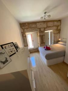 En eller flere senge i et værelse på Actualizado 2024, Centro, Pleno Casco Vello