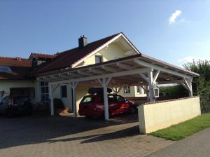 a garage with a car parked under it at Appartement Haus Anja in Bad Füssing