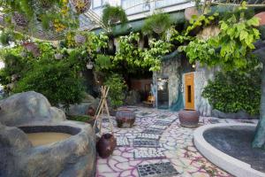 a garden with a stone walkway in a building at Galina Hotel & Spa in Nha Trang