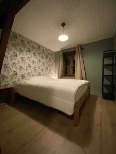 Postel nebo postele na pokoji v ubytování Le Gîte d’Orpha