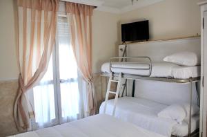 Postel nebo postele na pokoji v ubytování Hotel Tahiti