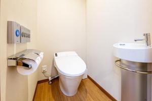 a bathroom with a toilet and a sink at Hotel Meldia Shijo Kawaramachi - Vacation STAY 86747 in Kyoto