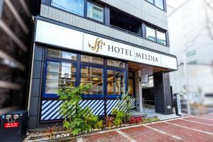 a hotel melia with a sign on a building at Hotel Meldia Shijo Kawaramachi - Vacation STAY 86747 in Kyoto