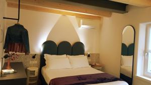 A bed or beds in a room at Relais Sant'Anna