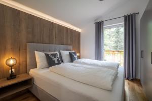 Postel nebo postele na pokoji v ubytování Luxalps- Turrach Alm Chalets Nr 1-4 Grünsee- Sauna- Skifahren- Wandern- Natur