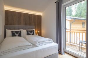 Postel nebo postele na pokoji v ubytování Luxalps- Turrach Alm Chalets Nr 1-4 Grünsee- Sauna- Skifahren- Wandern- Natur