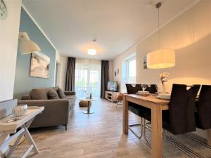 Posezení v ubytování Nordsee Park Dangast Haus 6 Whg. 2 Strandläufer