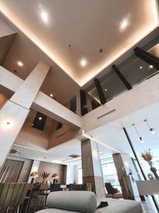 a lobby of a building with a large ceiling at The Brunei Hotel in Bandar Seri Begawan