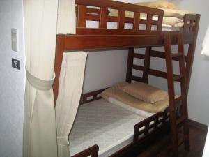 a couple of bunk beds in a room at Yukaina Nakamatachi in Yakushima