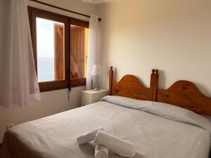 Postel nebo postele na pokoji v ubytování Wonderful Apartment with Outstanding Views - Calella de Palfrugell