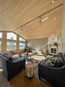 a living room with two couches and a fireplace at Ahmic Lake Resort in Magnetawan +263 photos