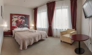 Postel nebo postele na pokoji v ubytování Hotel Navalis, Klaipėda