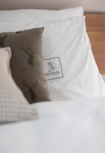 Voodi või voodid majutusasutuse Boutique Skipass Superior Hotel toas