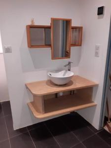 a bathroom with a bowl sink and a mirror at St Elme, maison de pêcheurs, WIFI jardin in Ault +37 photos