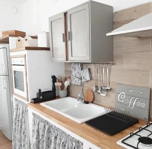 a kitchen counter with a sink in a kitchen at Stè Sweet home M&A in Scanzano