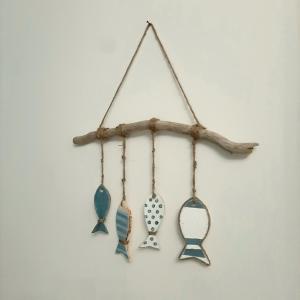 a group of four earrings hanging from a branch at Stè Sweet home M&A in Scanzano