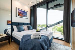 Posteľ alebo postele v izbe v ubytovaní Q18 ApartHotel